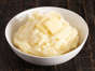 Mashed Potatoes with Butter on a Wooden Table