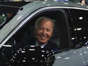 President Joe Biden drives a Cadillac Lyriq through the showroom during a tour at the Detroit Auto Show, Sept. 14, 2022, in Detroit.