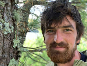  Django Kroner, 32, started his business, The Canopy Crew, to help people reconnect with nature. The business rents treehouses in Kentucky's Red River Gorge, some for up to $950 a night. Take a look at one of the properties with two single-room sheds he refers to as "Cliff Dweller." The entrepreneur Django Kroner describes his dream home as a treehouse on a cliff where he can see miles of forest and where tree-dwelling critters can come visit him in the morning. And it's this vision that motivated the 32-year-old to bring a slate of treehouse vacation rentals from his imagination to reality.As the owner of The Canopy Crew, which operates in Kentucky's Red River Gorge, Kroner said he wanted to give people a creative outlet to interact with wildlife the way he does."Everyone thinks about children when they think of treehouses," Kroner said. "But an adult treehouse can bring out your inner child, which is something everyone should harness."Kroner moved to the Red River Gorge area in 2009 because of the location's world-renowned rock climbing. He took a job building timber-frame cabins with a wilderness cabin-rental company called Red River Gorgeous soon thereafter, and he asked the owners whether he could build a treehouse on the property. The owners obliged, and he built his first 10-foot-by-8-foot structure out of scrap material about 45 feet in the air between a tulip tree and a sycamore, he explained. That first treehouse was more of a canopy, Kroner added. It didn't have any walls, but he had a chest for his clothes and slept in a hammock. If he needed to keep food overnight, Kroner said, he used a net rope to lower a basket into the creek running between the two trees that supported the treehouse. Kroner said he slept in that canopy year-round. It was after Kroner's friends began to visit his treehouse when he came up with the idea for The Canopy Crew. Kroner launched the company in November 2013 with just one treehouse that he built for about $10,000, he said. Since then, the company has added nine more treehouses that cost $200,000 to $400,000 to build, some of which rent for as much as $950 a night on Airbnb. The company also employs about 50 people, who are split between its vacation-rental business and the tree-service operation it provides in Cincinnati.When he's scouting a new location for a treehouse, Kroner said, he looks for a place in the woods where he'd like to hang out. Sometimes, he finds a few trees that can support one of the designs he's sketched in his notebook. Other times, the landscape dictates the design, he said."Whenever I'm up in a treehouse, all I can think about are suspension bridges and other connections going out into the trees further into the gorge," Kroner said.The company's most recent addition is a treehouse known as "Sky Dancer," which looks like a pirate ship that was built into a cliff face. There are three separate structures that make up Sky Dancer, each of which is connected by wooden staircases and has its own primary bedroom and bathroom. It also has a giant net that serves as a hammock and unbeatable views of the gorge, Kroner said.While there are plenty of treehouse builders to choose from, Kroner said The Canopy Crew was one of a handful of companies that could build treehouses into landscapes the way they do. The Canopy Crew uses techniques that Kroner picked up during an apprenticeship with an arborist that are meant to protect the trees they build in, including lowering materials into place instead of hoisting them off the ground and taking the time to appropriately prune the branches. This allows The Canopy Crew to build their structures higher off the ground than other treehouse builders."I like to think of these treehouses as blunt reminders that we don't have to live in busy cities or chase material objects all day long," Kroner said. 