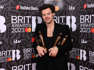 Harry Styles with his BRITs haul