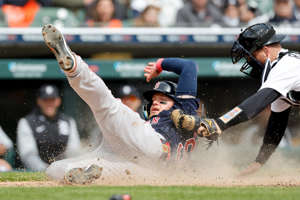 April 6: The Boston Red Sox's Alex Verdugo slides in safe at home ahead of the tag by Detroit Tigers catcher Jake Rogers in the sixth inning at Comerica Park. The Red Sox won the game, 6-3.
