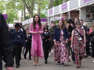 Kate looks pretty in pink as she surprises school children with a picnic at Chelsea flower show