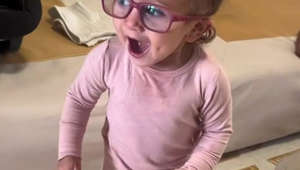 Watch this 1-year-old try on glasses that let her see clearly for the first time ever