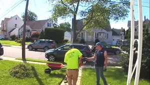 This man was working in his yard when his nephew came over to give him some gloves. But he ended up accidentally striking his nephew with the string trimmer when he turned towards him. He instantly started apologizing while laughing a little at his nephew's reaction as he started yelping while hopping on one leg.