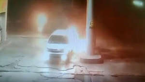 Close call: Driver ignores flame-engulfed car and flees gas station