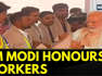 PM Narendra Modi Felicitates Workers Involved In The Construction Of The New Parliament Building