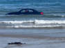 BMW driver criticised after £100,000 car is washed out to sea
