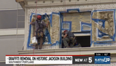Crews clean graffiti from Portland's historic Jackson Building over a year after vandalism