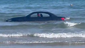 Coastguard jokes “you can’t park there!” after a BMW is washed out to sea