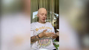 "I lost my hair to cancer and got a giant tattoo on my head as a 'F you' to the disease"