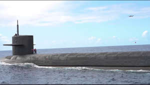 201019-N-LI768-2001 PACIFIC OCEAN (Oct. 19, 2020) An unmanned aerial vehicle delivers a payload to the Ohio-class ballistic-missile submarine USS Henry M. Jackson (SSBN 730) around the Hawaiian Islands. Underway replenishment sustains the fleet anywhere/anytime. This event was designed to test and evaluate the tactics, techniques, and procedures of U.S. Strategic Command's expeditionary logistics and enhance the overall readiness of our strategic forces. (U.S. Navy video by Mass Communication Specialist 1st Class Devin M. Langer/Released)