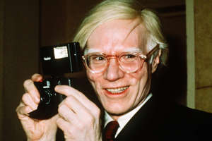 In this 1976 file photo, pop artist Andy Warhol smiles in New York. The Supreme Court on Thursday, May 18, 2023, sided with a photographer who claimed Warhol violated her copyright on a photograph of the singer Prince. (AP Photo/Richard Drew, File)