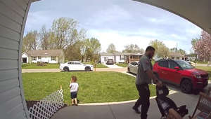 A young son looks on as his dad who is running late for work leaves without giving him a goodbye kiss – before he remembers and calls him over for a bigtime spirit-boosting hug. Dontae, aged three, was caught on security camera looking and acting down while sitting outside a family friend's house as his dad, J Roundtree, 31, headed off to work for the day. But then, as he is about to get into his car, J, from Pleasantville, Ohio, looks back at his son and realizes there's one thing that Dontae is waiting for so calls him over. Dontae excitably runs to his father, and J throws the youngster up in the air before bringing him in for a big hug goodbye.