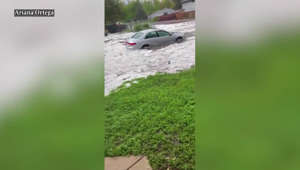 Rain and hail nearly submerge cars in Colorado city
