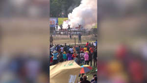 Rocket explodes in spectacular fail showering locals in smoke and sparks