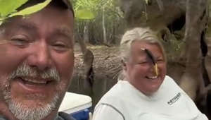 This couple had gone fishing together. However, the wife accidentally got the fishing rod's hook stuck to her forehead. She then laughed out loud with her husband at her hilarious fail.