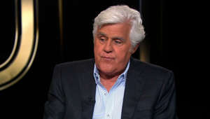 Jay Leno shows his new ear after accident