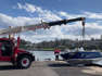 A boat that took on water as it was launched off the boat ramp at Kiama Harbour is retrieved. Video by Nadine Morton