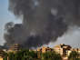 Smoke rises above buildings in Khartoum on May 17, as fighting between the two rival Sudanese generals continued. AFP