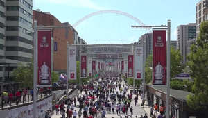 Fans arrive at Wembley Stadium ahead of the FA Cup final