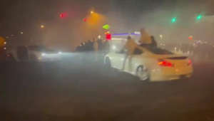 Drivers perform doughnuts and burnouts as crowds take over Philadelphia intersection