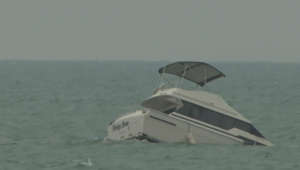 Boat remains partially sunk on Lake Michigan days after passengers rescued