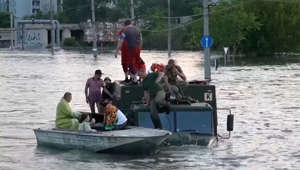 Watch: Kherson residents seek safety on military trucks after dam breach flooding