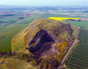 Photographer Andrew Smith says: ‘I have been capturing the environment I find myself in by drone commercially and as a personal pursuit for the past five years. In that time that natural world and our relationship with it has fascinated me. [Pictured is] Traprain Law, East Lothian. Once home to the Votadini tribe who ruled this area of Scotland at the time of Roman occupation, two layers of fortifications can be seen at the edges and a huge hoard of Roman silver was found here. Yet despite its rich history and cultural importance, this volcanic plug was mined until it was banned in the 1960s, causing the eyesore you see here.’ (Picture: Andrew Smith)