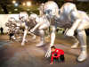 Osvaldo Ortiz (age 10) poses with a football player sculpture during fanfest at Dallas Convention Center.