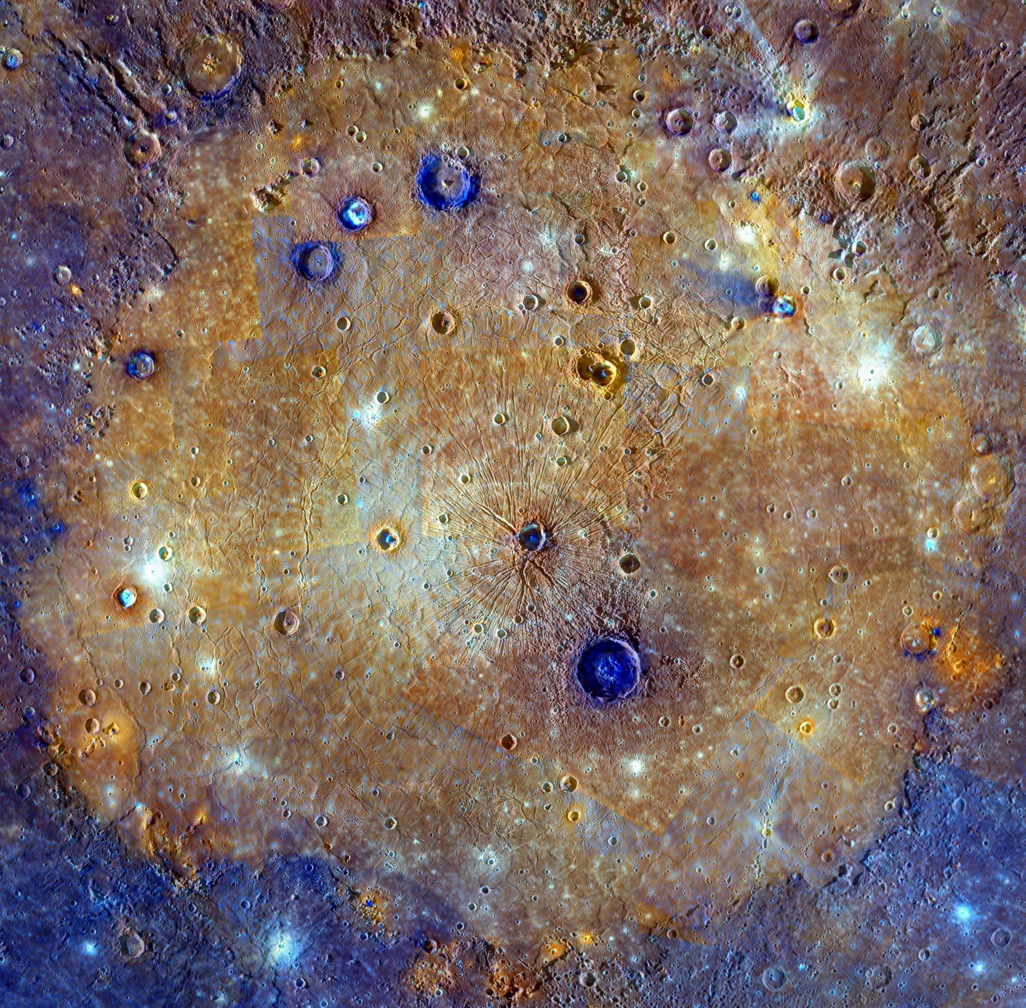 The sprawling Caloris basin on Mercury is one of the solar system's largest impact basins, created during the early history of the solar system by the impact of a large asteroid-sized body. The multi-featured, fractured basin spans about 1,500 kilometers in this enhanced color mosaic based on image data from the Mercury-orbiting MESSENGER spacecraft. Mercury's youngest large impact basin, Caloris was subsequently filled in by lavas that appear orange in the mosaic. Craters made after the flooding have excavated material from beneath the surface lavas. Seen as contrasting blue hues, they likely offer a glimpse of the original basin floor material. Analysis of these craters suggests the thickness of the covering volcanic lava to be 2.5-3.5 kilometers. Orange splotches around the basin's perimeter are thought to be volcanic vents.
