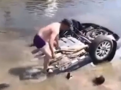 Heroic men rescue people trapped in car that landed upside down in river