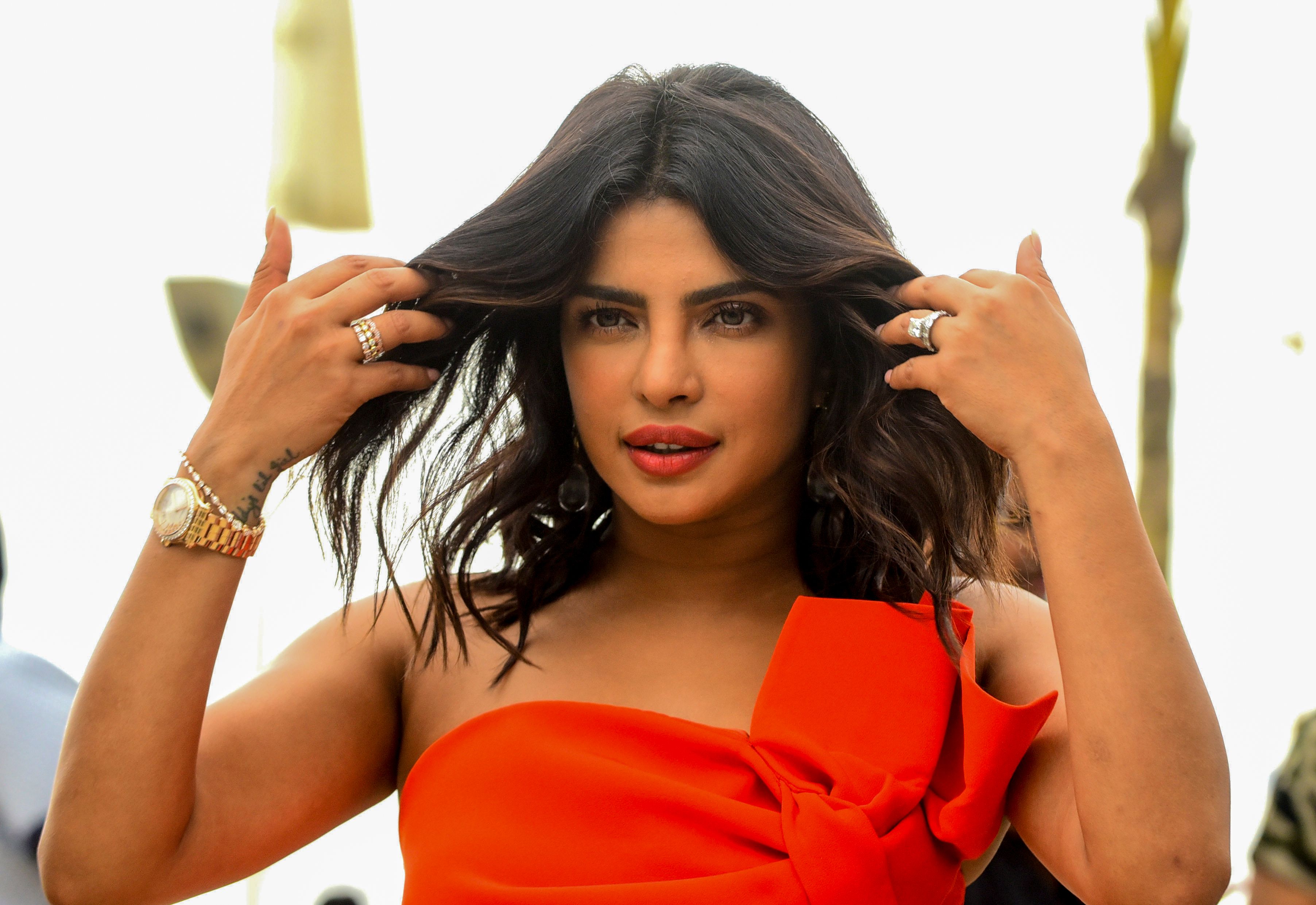Bollywood actress Priyanka Chopra Jonas gestures as she poses for photographs during the promotion of the upcoming biographical Hindi film 'The sky is pink in Mumbai on September 26, 2019. (Photo by Sujit Jaiswal / AFP)        (Photo credit should read SUJIT JAISWAL/AFP/Getty Images)