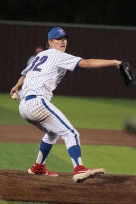 a baseball player is getting ready to pitch the ball: Bullard (Texas) High School senior left-hander Hagen Smith logged an 11-0 record and fanned 169 batters in 73 innings en route to seven no-hitters.