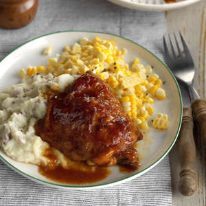 a plate of food with rice: Saucy Chicken Thighs Exps Scmbz17 32244 C01 12 5b 2