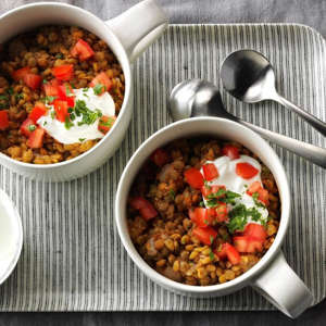 a bowl of food on a plate: Tomato Garlic Lentil Bowls Exps Sdon16 136664 D06 09 6b 2