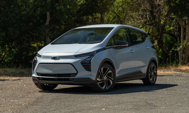 a car parked on the side of a road: Chevrolet's little electric Bolt has been redesigned for the 2022 model year.