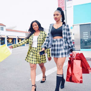 a woman posing for a picture: Cher And Dionne From Clueless Halloween Costume