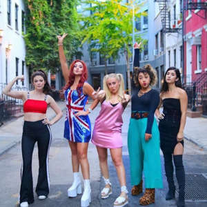 a group of people posing for the camera: The Spice Girls Halloween Costume