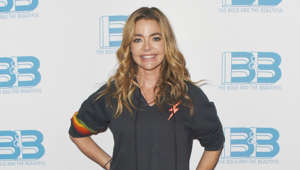 Denise Richards holding a sign: Denise Richards’ adopted daughter Eloise was diagnosed with a chromosome disorder in 2017, Chromosome 8, Monosomy 8p, which affects her speech. 'The Real Housewives of Beverly Hills' star has been very open about her child's condition and has admitted that doctors don’t have a concrete answer to her particular case. Speaking to PEOPLE, she said: "I don’t know if she is ever going to talk like a typical child, but as a parent you want what’s best for your children." Denise has learned sign language to be able to communicate better with Eloise.