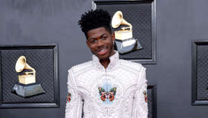Lil Nas X never fails to make every best-dressed list, and the Grammys were no exception. He strutted the carpet in an all-white quilted Balmain suit with pearl detailing and butterflies imprinted on the chest and arms. He paired the suit with matching white platforms, blue eyeshadow, and grills.