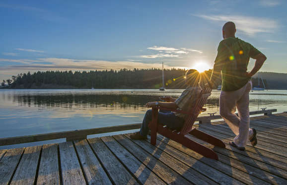 Men relaxing on pier.