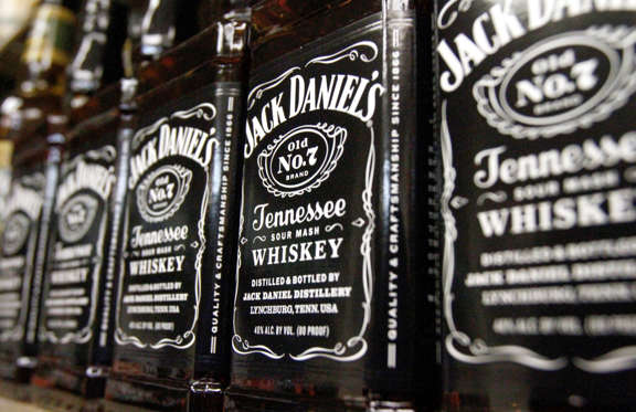 In this Dec. 5, 2011 photo, bottles of Jack Daniel&#39;s Tennessee Whiskey, line the shelves of a liquor outlet, in Montpelier, Vt. Liquor maker Brown-Forman Corp. reported a 2 percent gain in second-quarter profit Thursday, Dec. 8, 2011, on the strength of sales spikes for its flagship Jack Daniel’s Tennessee Whiskey along with its vodka and tequila brands.