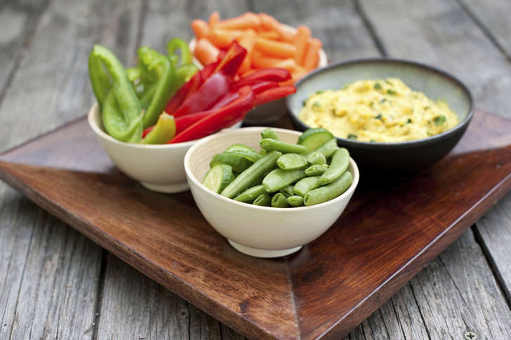 Fresh cut vegetables with hummus dip