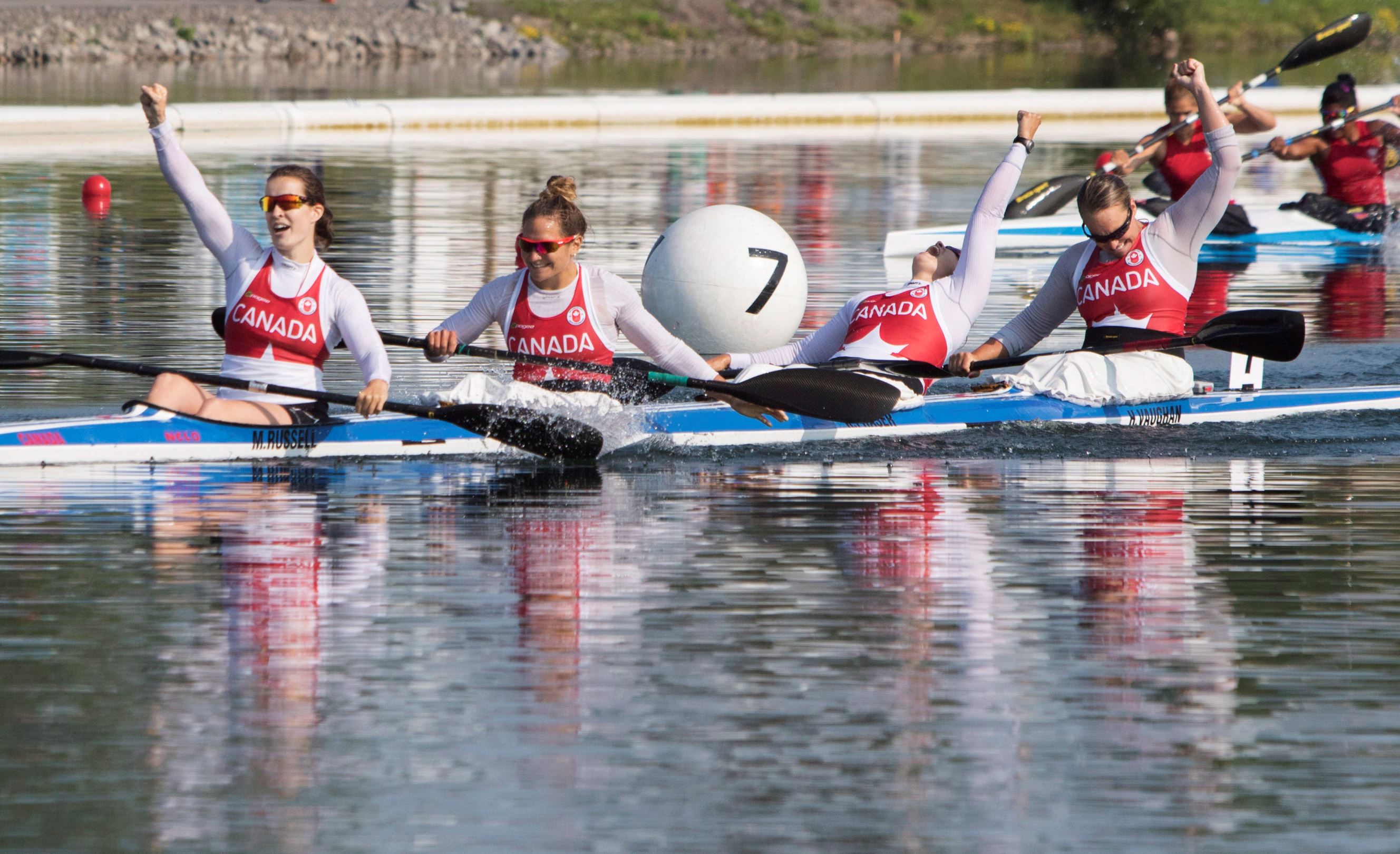 Canada's women's K4 kayak team celebrate winning the first gold medal of the 2015 Pan Am Games in the 500m final in Welland, Ont., Saturday, July 11, 2015.