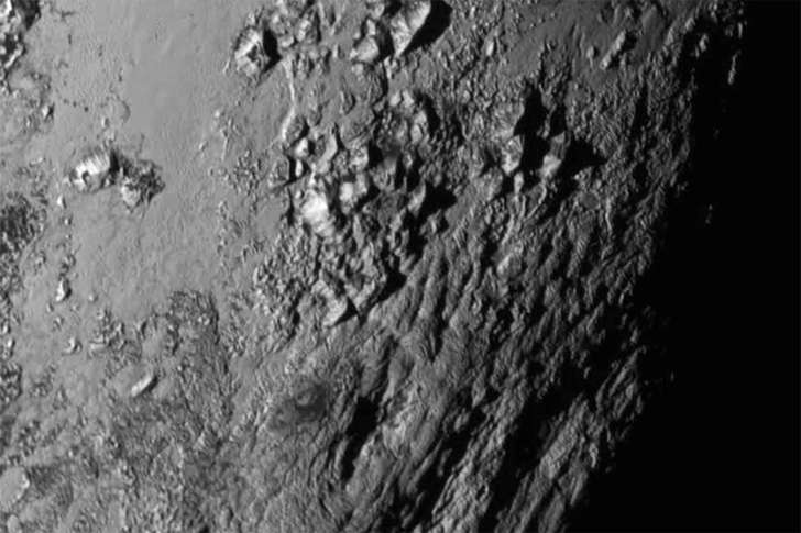 New close-up images of a region near Pluto’s equator reveal a giant surprise: a range of youthful mountains rising as high as 11,000 feet (3,500 meters) above the surface of the icy body.  The mountains likely formed no more than 100 million years ago -- mere youngsters relative to the 4.56-billion-year age of the solar system -- and may still be in the process of building, says Jeff Moore of New Horizons’ Geology, Geophysics and Imaging Team (GGI). That suggests the close-up region, which covers less than one percent of Pluto’s surface, may still be geologically active today.