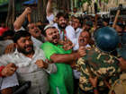 India's Bharatiya Janata Party (BJP) activists supporting death penalty of 1993 Mumbai blasts accused Yakub Abdul Razak Memon, are stopped by police during a protest in Mumbai, India, Wednesday, July 29, 2015.