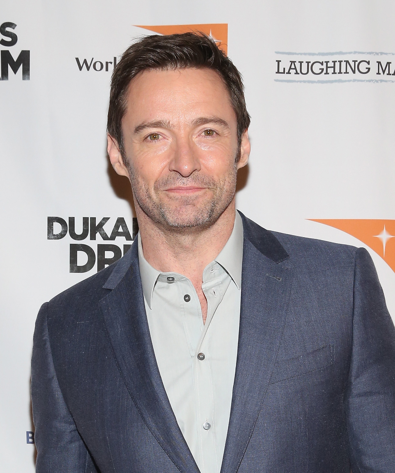Hugh Jackman shows chiseled beach