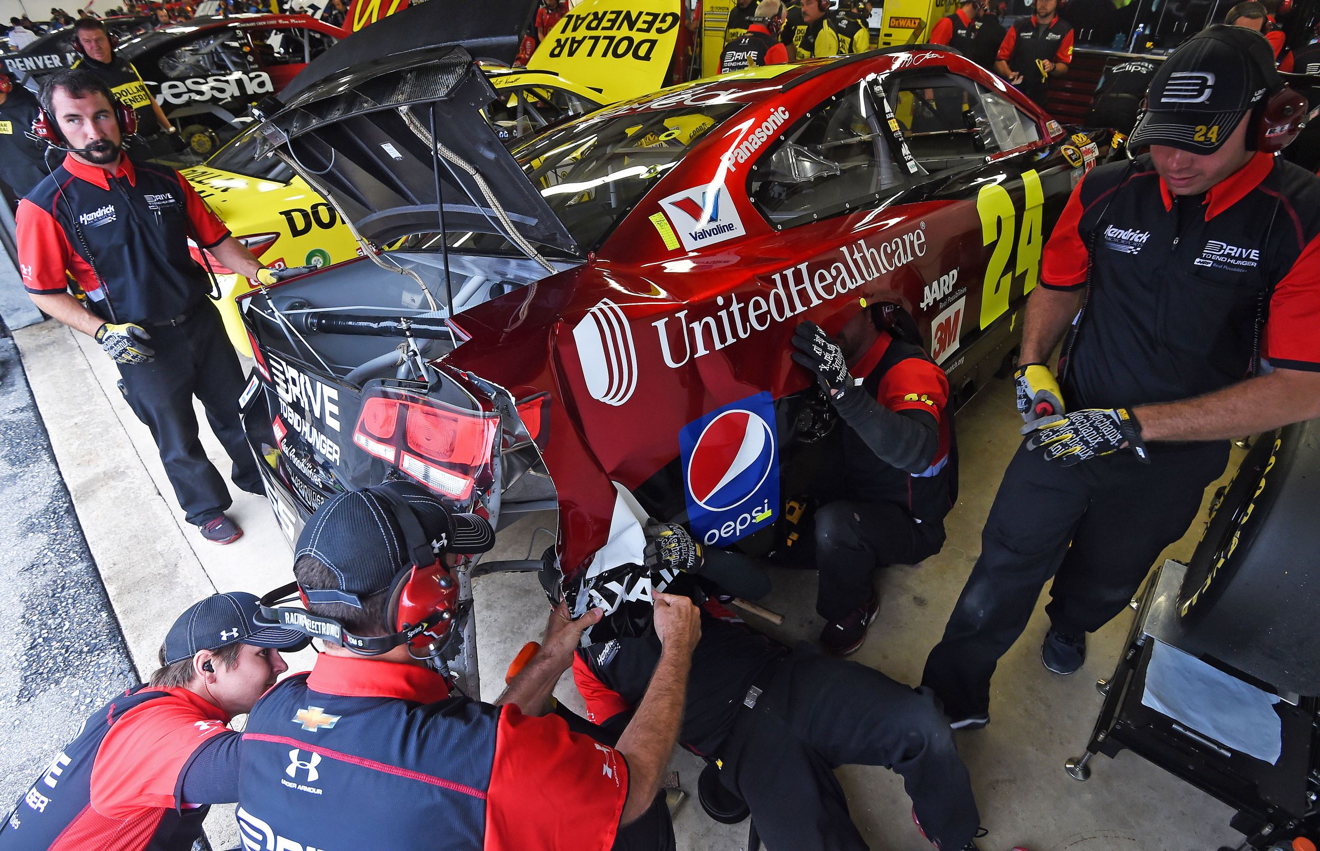 Crew members for Jeff Gordon, driver of the <a href=