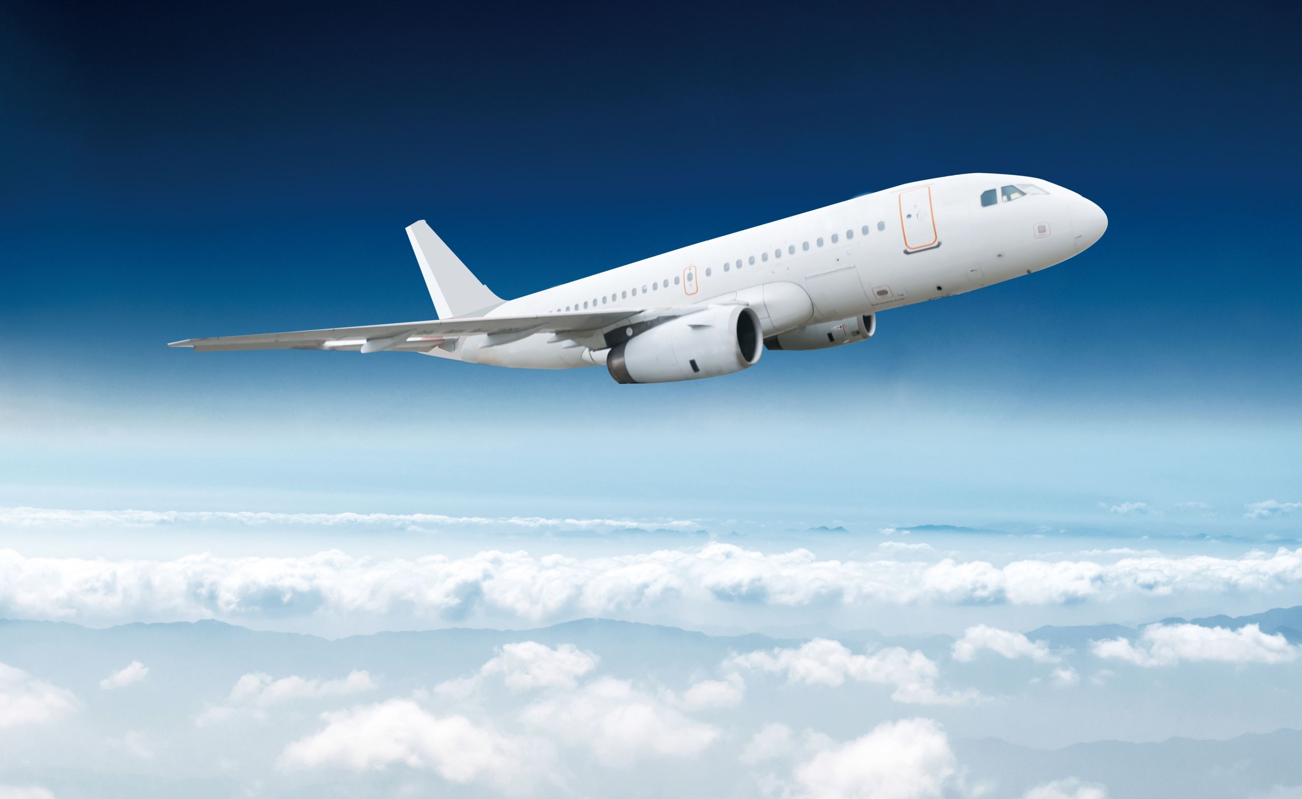 Passenger airliner flight in the blue sky