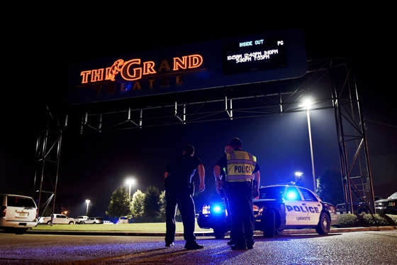 Louisiana shooting - Stacy Revere/Getty Images LAFAYETTE, LA - JULY 23: Lafayette police stand outside of the Grand Theater on July 23, 2015 in Lafayette, Louisiana. Three people are dead and seven more injured after a gunman opened fire inside the Grand Theatre. The gunman, whose identity is being withheld by police, is among the dead. (Photo by Stacy Revere/Getty Images)